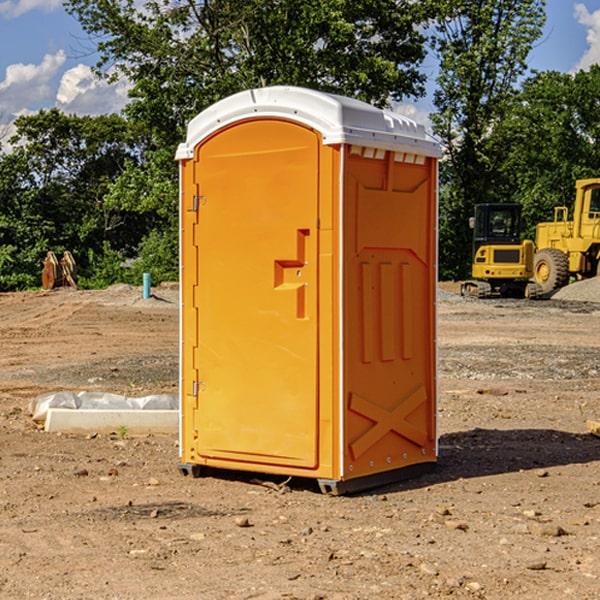 what is the cost difference between standard and deluxe portable restroom rentals in Reubens